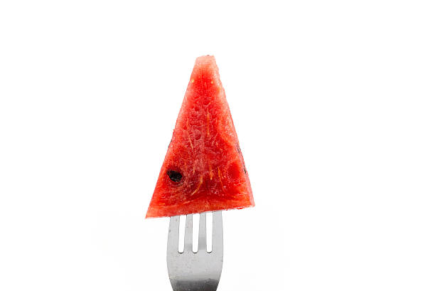 A bite at a little slice of watermelon.
