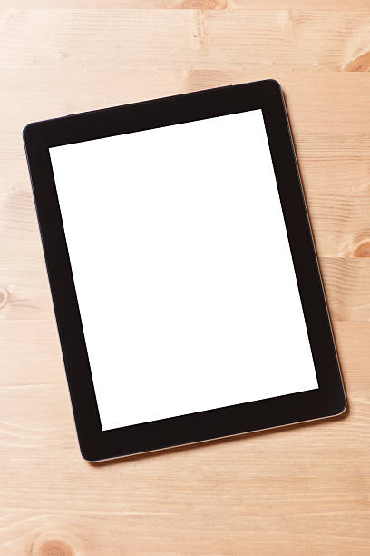 istock White blank screen digital tablet on wooden desk 473601854