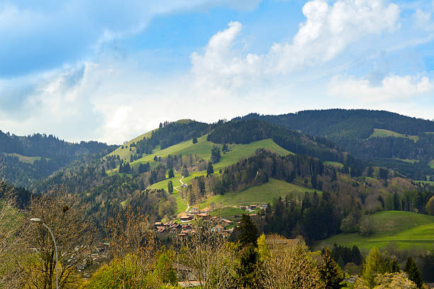 Beautiful hills near Gruyeres castle, Switzerland Gruyere region of Switzerland in spring. Beautiful landscape, amazing place. Image taken in midday.  bulle stock pictures, royalty-free photos & images