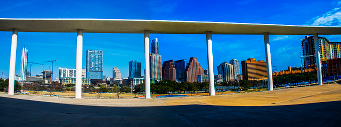 panoramic view of Austin Texas Longhorn Event Center Architecture panorama. The white event center is circled with rich buildings and skyline view