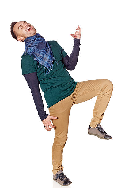 istock Young man playing air guitar 473606900