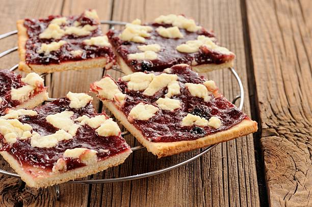 istock Berry jam cookies on wooden background 473607344
