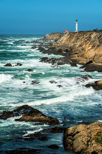 Verical composition of stormy ocean waves battering the coastline near the Point Arena Lighthouse on the Sonoma Coast in Calfironia