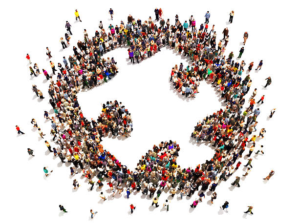 istock Many people forming a giant puzzle piece 473609000