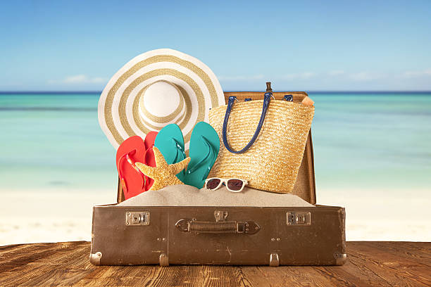istock Travel concept with old suitcase on wooden planks 473609464