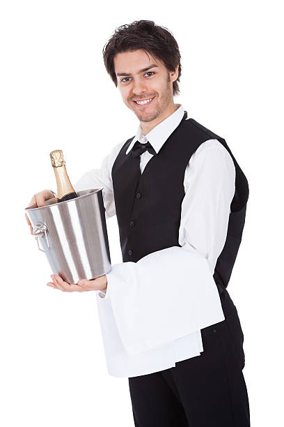 retrato de un mayordomo con botella de champán - waiter butler champagne tray fotografías e imágenes de stock
