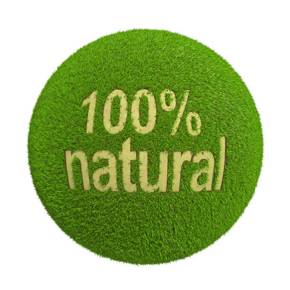 Ball with inscription of natural grass product gaps background