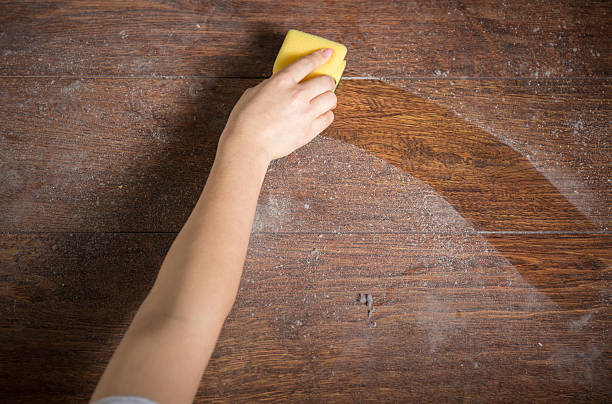 Using sponge for cleaning dusty wood Using yellow sponge for cleaning dusty wood dust stock pictures, royalty-free photos & images