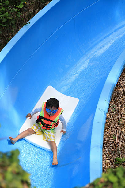 istock Japanese boy on the water slide (5 years old) 473616608