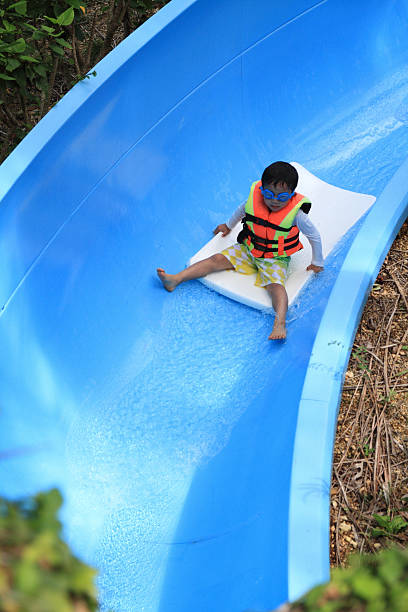 istock Japanese boy on the water slide (5 years old) 473616610