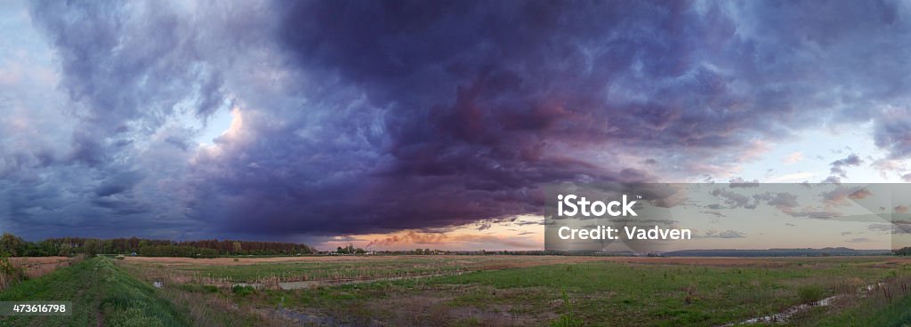 Sunset before storm. Purple dramatic sky. Sunset before storm. The dark clouds before the storm. 2015 Stock Photo
