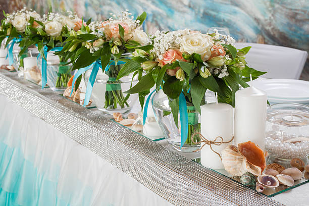 istock Beautiful bouquets of roses and decorations on table at wedding 473617460