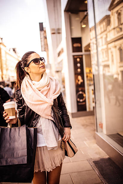 istock Window shopping and coffee to go 473619748