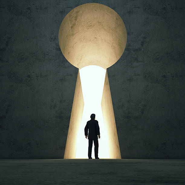 istock Businessmen front of key hole door concept. 473623100