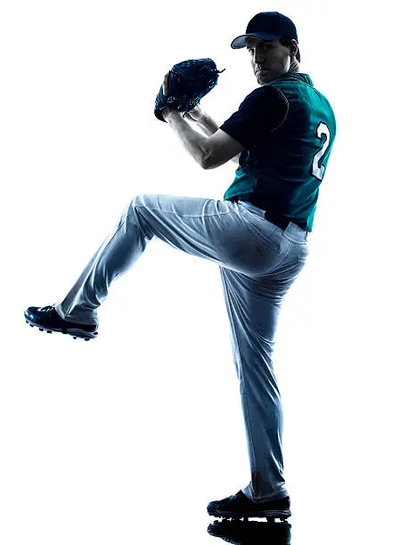 one caucasian man baseball player playing  in studio  silhouette isolated on white background