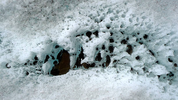 Small black pieces of soot and dirt blowing onto the glaciers from all over the planet are causing our glaciers to melt faster and faster.  One small piece of climate change you can watch happening.