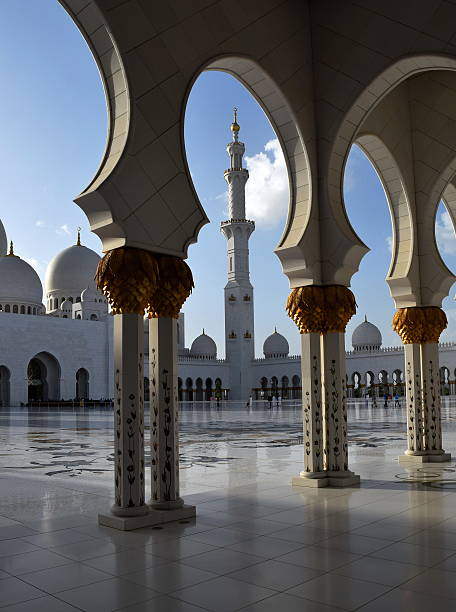 istock grand mosque tower between golden pillars 473633854