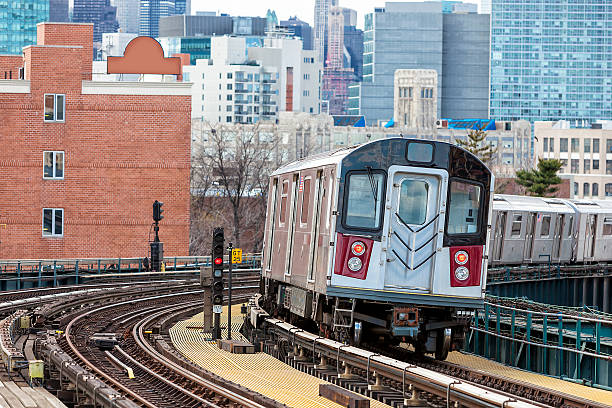 istock Subway Train Speeding on Elevated Track in Queens, New York 473638134