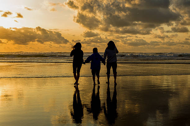 istock Family at the beach during sunset. 473641532