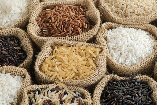 istock Group of organics rice in burlap bag 473649142