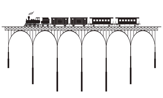 silhouette of openwork bridge and locomotive