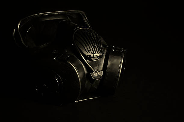 Gas Mask isolated on Black Black gas mask with filter canisters isolated on black m40 sniper rifle stock pictures, royalty-free photos & images