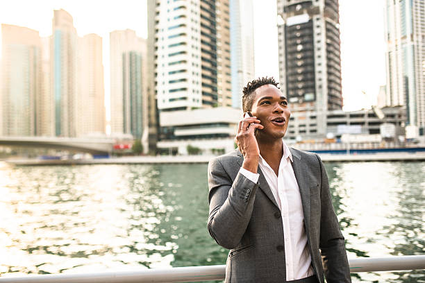 istock Businessman on the phone dubai marina 473660512