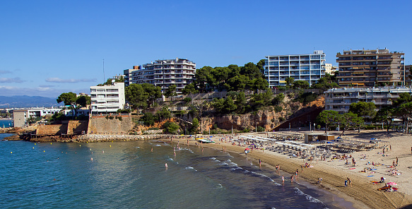 Panoramic view of Calella de Palafrugell old village in a summer morning with a blue sea and sky with a lot of little boats parked in front. Costa Brava, Girona province, Catalonia. Spain