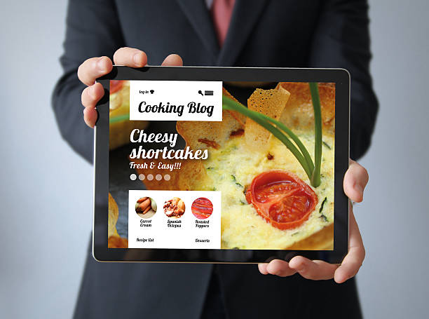 istock businessman with cooking blog on a tablet 473669104