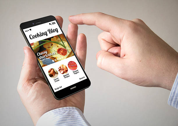 istock touchscreen smartphone with online cooking blog on the screen 473669200