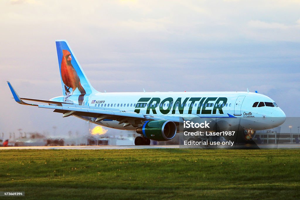 Frontier Airlines A320 at Cleveland Hopkins International Airport Cleveland, OH, USA - May 12, 2015: In the morning, Frontier Airlines A320 (Orville, the red Cardinal) just landed at Cleveland Hopkins International Airport. Frontier Airlines Stock Photo