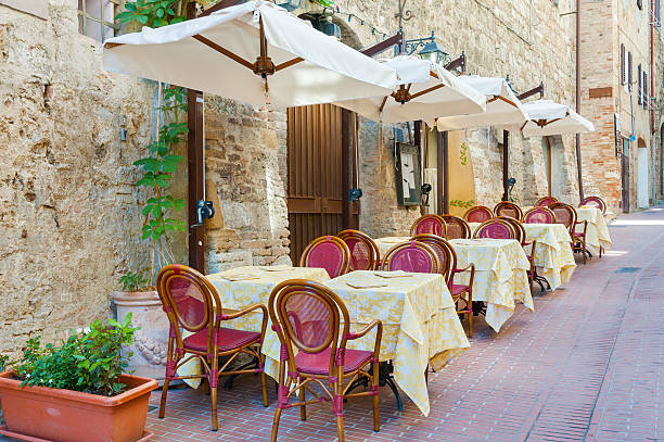 Nice and cosy sidewalk cafe in resort town San Gimignano, Tuscany, Italy
