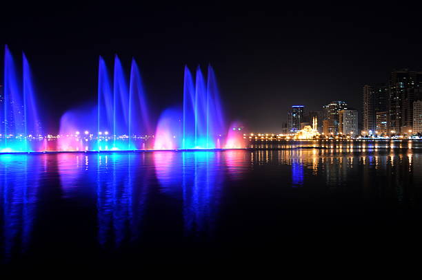 istock colorful dancing fountain with mosque background 473672502