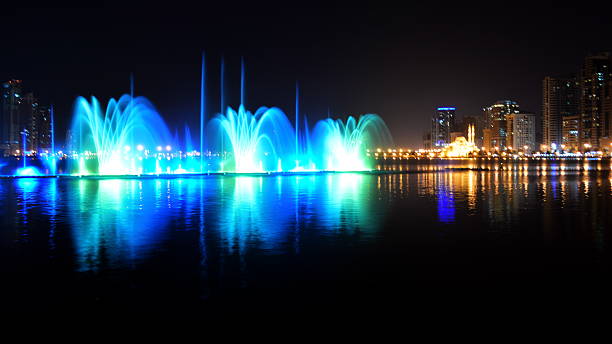 istock colorful dancing fountain with mosque background 473672504