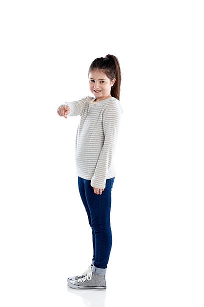 istock Beautiful little girl pointing at camera 473675316