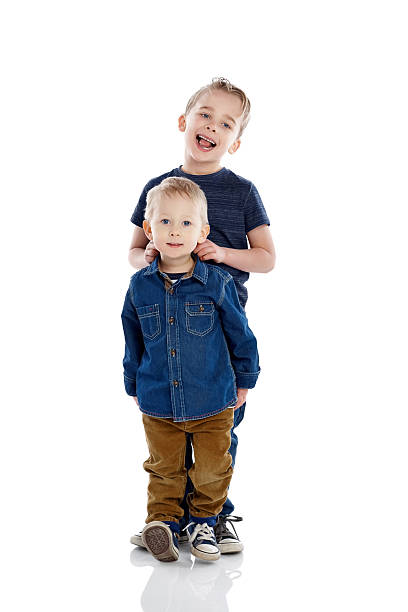 istock Young boys standing together and smiling 473675332