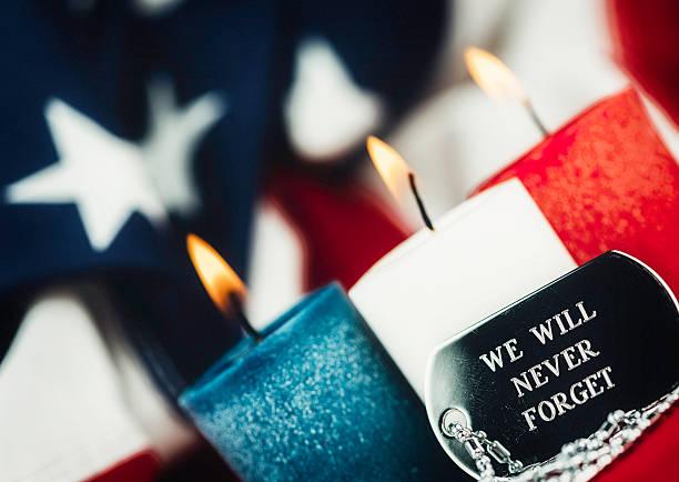 We will never forget. Memorial Day. Veterans Day remembrance message Patriotic candles with dog tags. We will never forget. Memorial Day. Veterans Day remembrance message us memorial day photos stock pictures, royalty-free photos & images