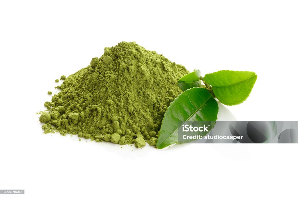 Matcha/ Green Tea powder and fresh green tea leaves Green Tea Stock Photo