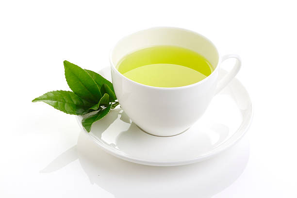 istock green tea and fresh green tea leaves 473678624