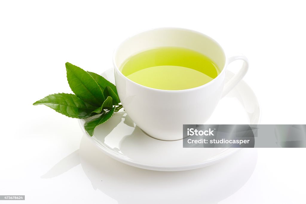 green tea and fresh green tea leaves Japanese green tea and fresh green tea leaves on white background Green Tea Stock Photo