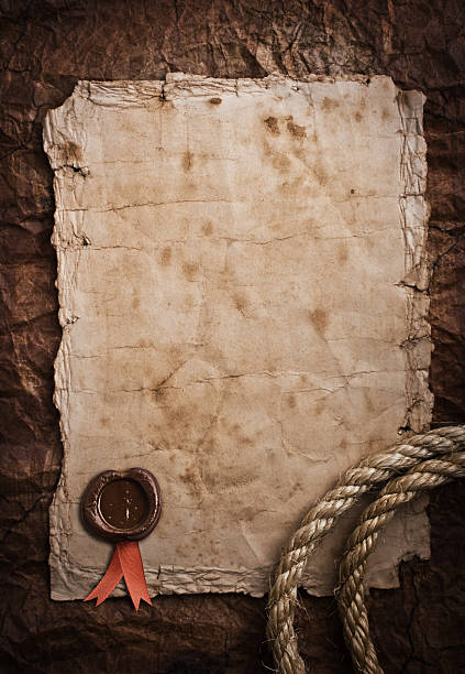 istock aged Rope on the old paper background 473682264