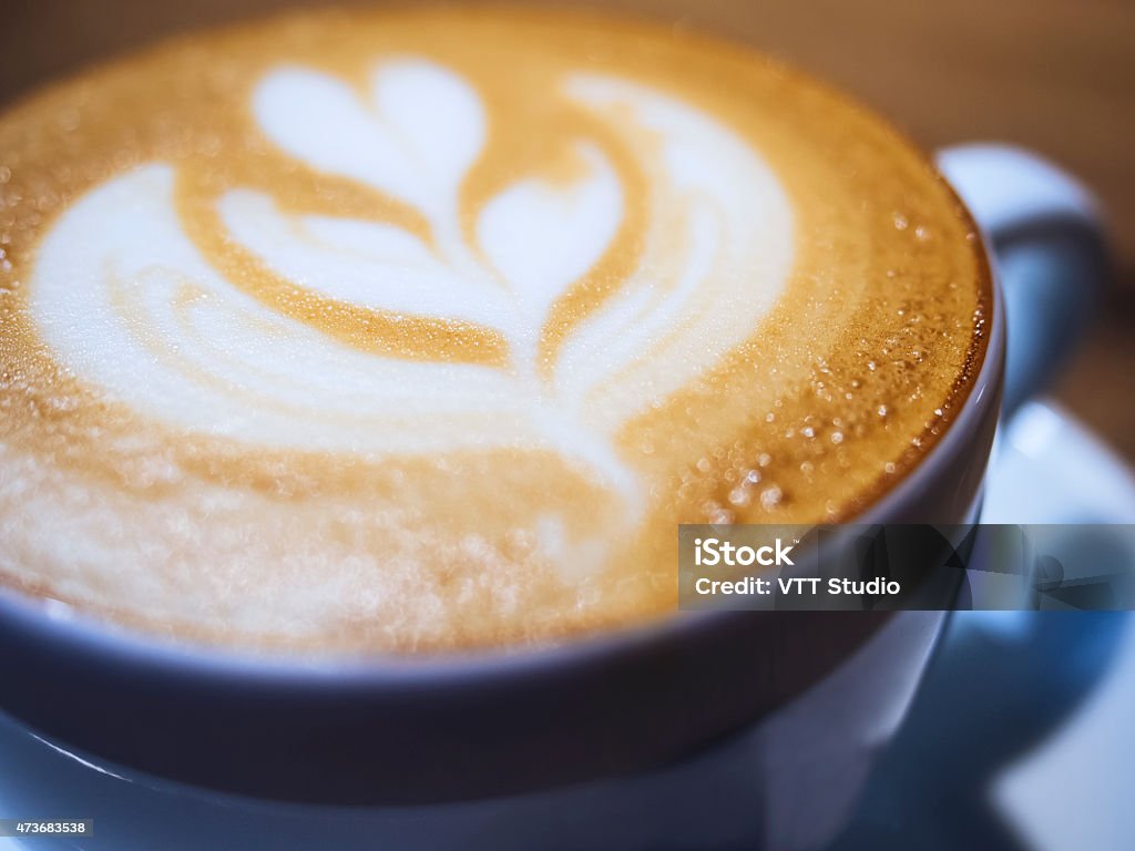Cappuccino coffee close up with leaf pattern milk foam Cappuccino coffee close up with leaf pattern milk foam, Cafe concept 2015 Stock Photo