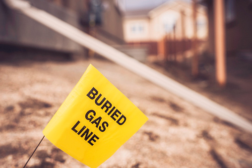 Buried gas line. Call before you dig. Construction and building