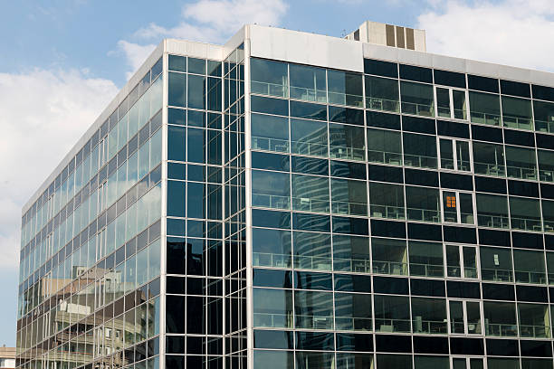 istock Skyscrapers from ground view with blue sky visible 473685120