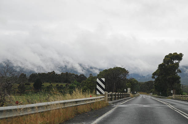 istock Early morning calm high way in mountain 473690818