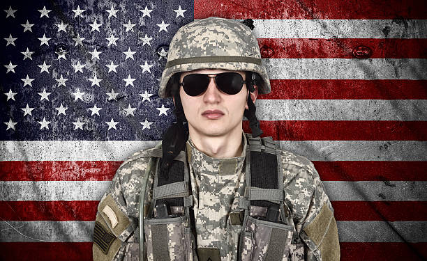 istock soldier and USA flag 473691450