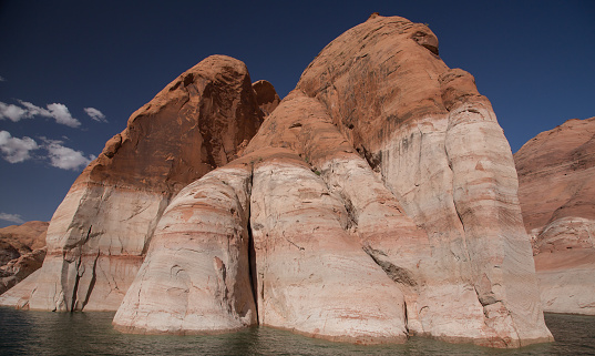 Multi-colored sandstone and rock formation in Lake Powell inside Glen Canyon.
