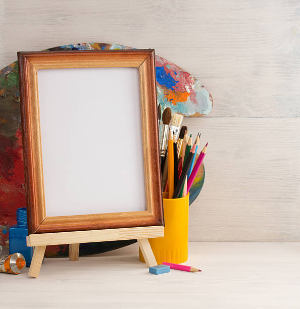 istock picture frame and paints on wood 473692172