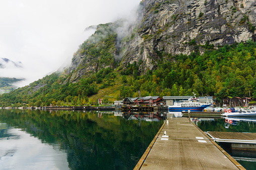 Pier and boats in Geiranger fjord, Norway