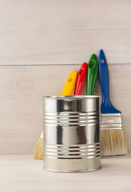 istock paint bucket and paintbrush  on wood 473698126